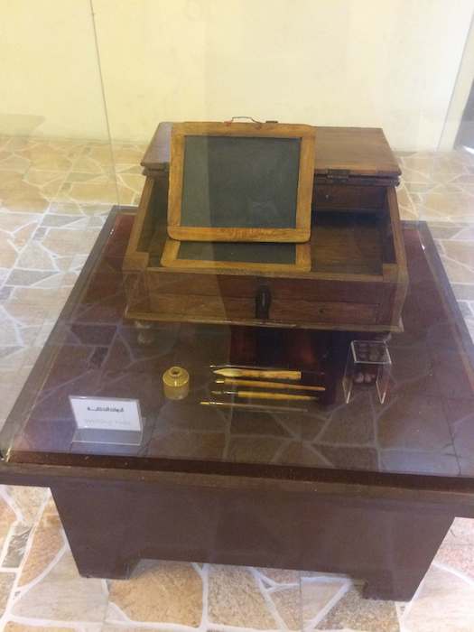 Umm al Quwain Museum exhibit - slate and writing equipment