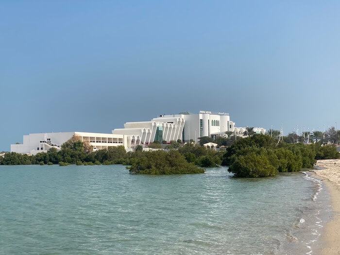 hotel mirfa abu dhabi mirfa resort in back ground, turquoise sea and mangroves in foreground