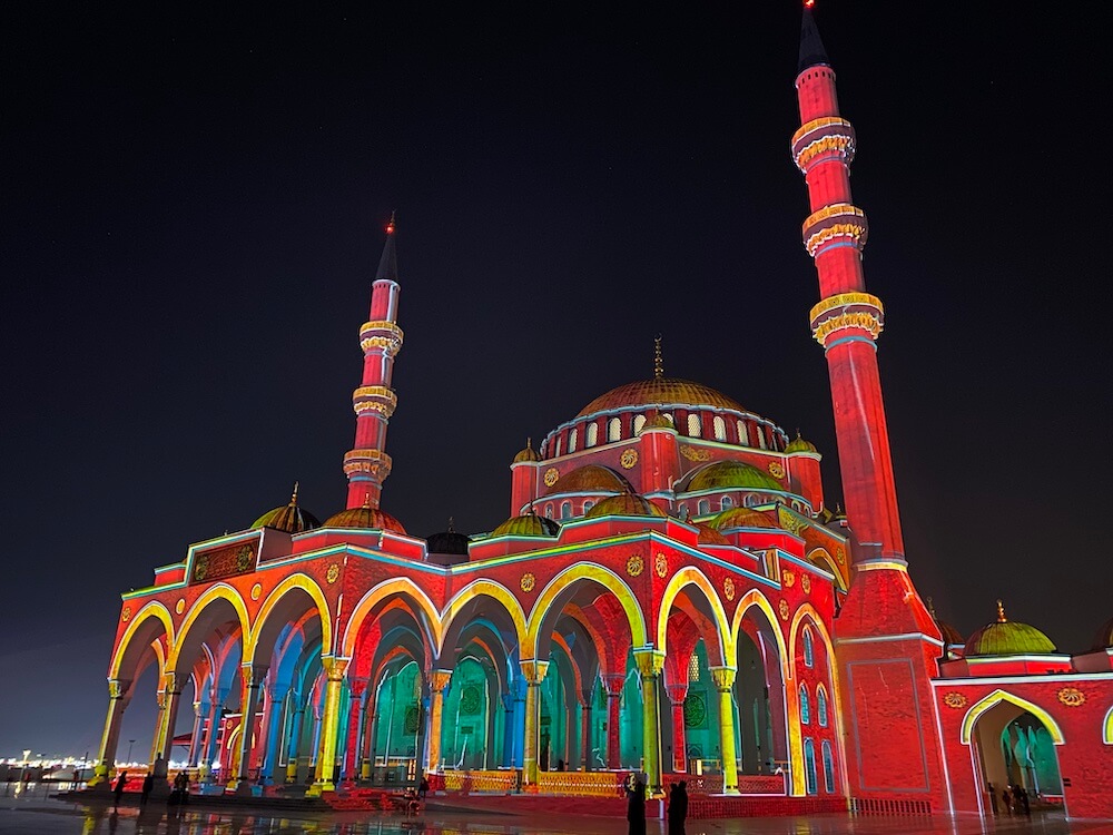 sharjah mosque with project mapping in vibrant colours during sharjah light festival 2020