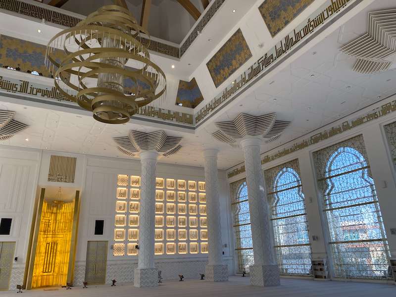 large windows, chandelier and 99 names of God inside sheikha amina bint ahmed alghurairi mosque
