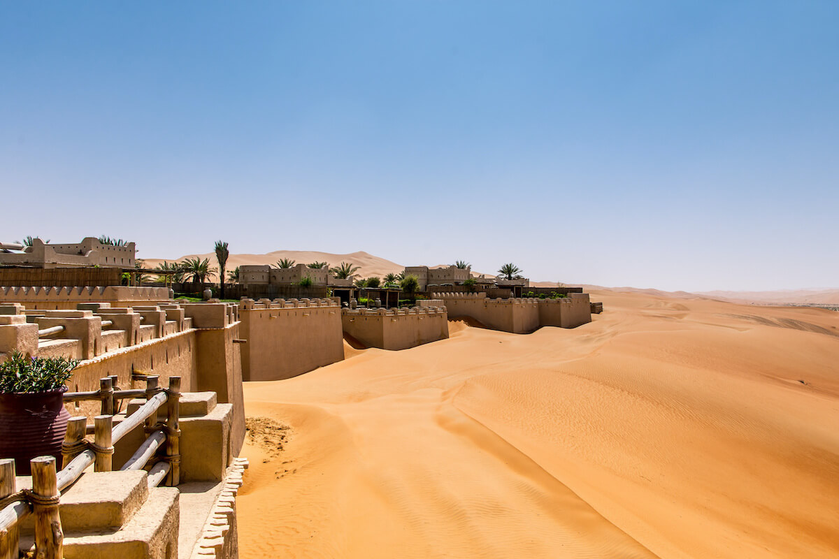 qasr al sarab hotel with a deep dune along the side