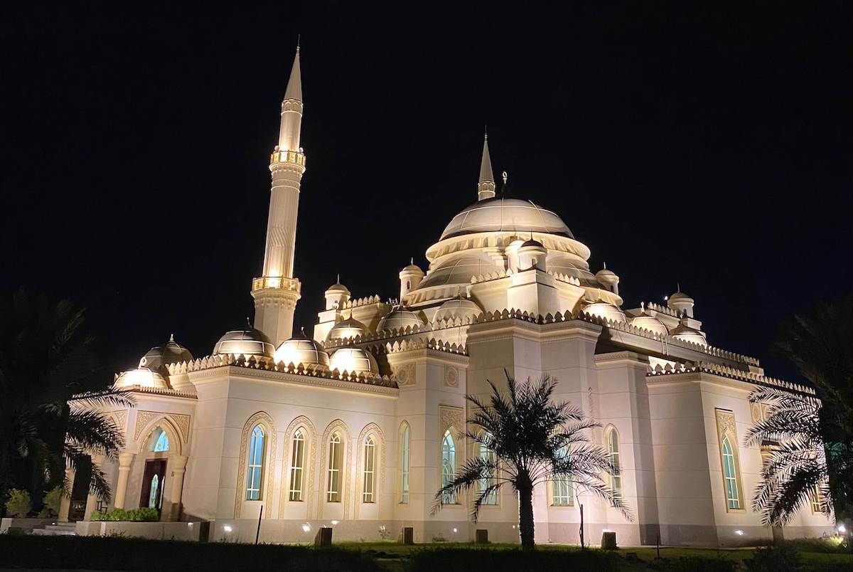 Mosque in Ottoman style lit up at night