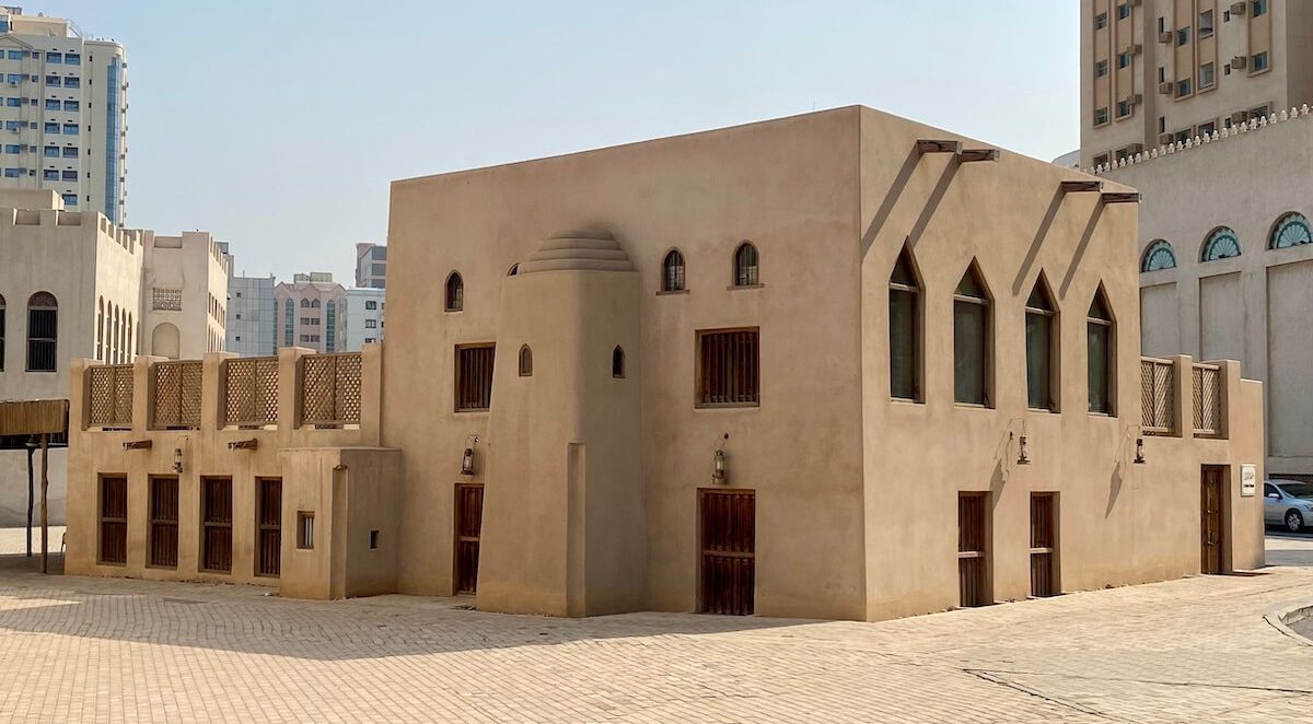 Old restored mosque in sandy colour with high mihrab