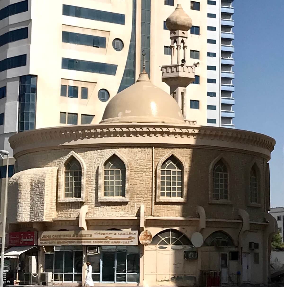 circular mosque with dome in city