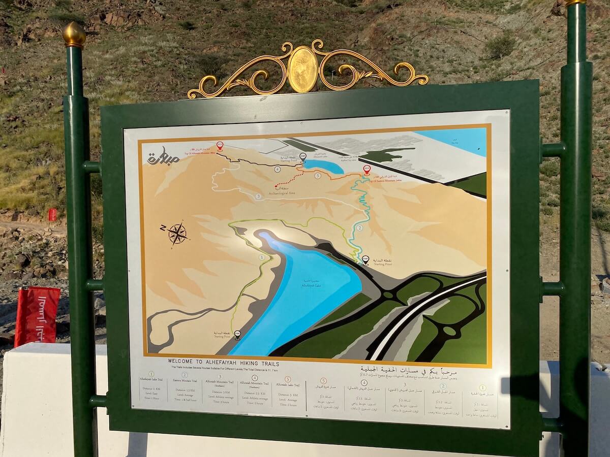 board with map of hiking trails