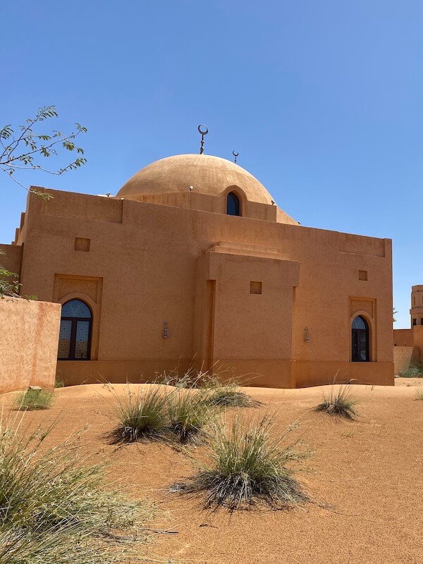 small mosque with dome built with sand-coloured material